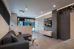 a living room with a couch and a table at A2 Apartment & Studio in Ružomberok