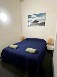 Postel nebo postele na pokoji v ubytování Sails Motel Geraldton