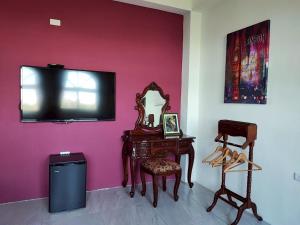 Televizorius ir (arba) pramogų centras apgyvendinimo įstaigoje Ding Shian B&B