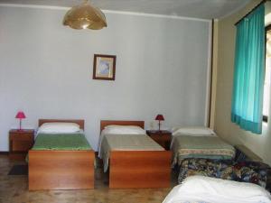 a hospital room with two beds and a window at Locanda La Rotonda in Montale