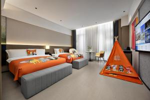 Postel nebo postele na pokoji v ubytování Beijing Suiyu Hotel + 37 fotografií