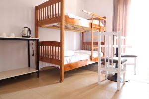 A bed or beds in a room at Central Hostel