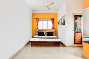 Ένα ή περισσότερα κρεβάτια σε δωμάτιο στο Hotel O Relax INN