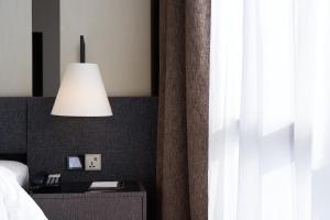 Postel nebo postele na pokoji v ubytování Impiana Hotel Senai