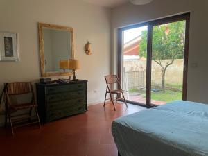 Ένα ή περισσότερα κρεβάτια σε δωμάτιο στο Villa Favazzina con Piscina