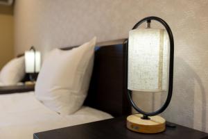 Postel nebo postele na pokoji v ubytování Miro Hotel Imadegawa