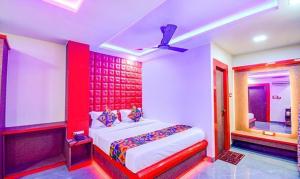 Ένα ή περισσότερα κρεβάτια σε δωμάτιο στο FabHotel The Crown Comforts