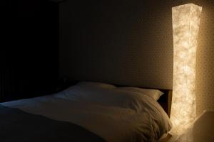 Postel nebo postele na pokoji v ubytování Miro Hotel Imadegawa