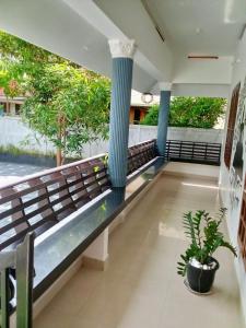 a view from the balcony of a building with columns at Farah Homestay in Varkala