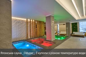 a swimming pool in the middle of a house at Fomich Residence in Bukovel +117 photos