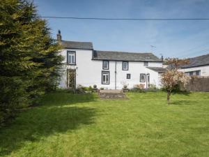 a large white house with a grass yard at 3 bed property in Pardshaw Lake District SZ419 in Dean