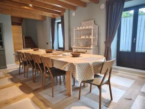 a dining room with a table and chairs at La Casa de La Villa by Casas de Los Picos in Panes