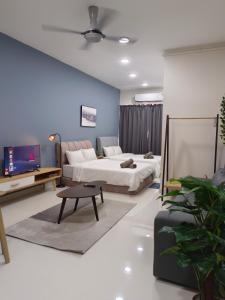 a living room with a bed and a couch at KLIA AIRPORT HOMESTAY in Sepang