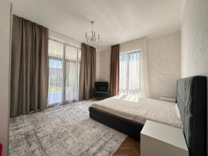 Postel nebo postele na pokoji v ubytování Ambassador Cottage