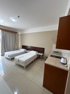 Postel nebo postele na pokoji v ubytování Ellis Hotel Apartments