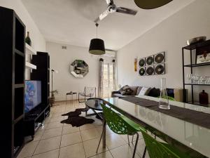 a living room with a couch and a table at Simons Apartments minutes away from Balluta Bay and St Julians in Sliema