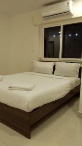 Postel nebo postele na pokoji v ubytování Hotel EP Deluxe Room