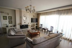 a living room with a couch and a table at Angels Home in Platanitis
