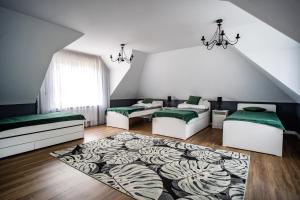 Posteľ alebo postele v izbe v ubytovaní Dom Nasutów