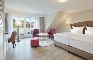Postel nebo postele na pokoji v ubytování Hotel Inselfriede