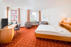 Postel nebo postele na pokoji v ubytování Hotel Inselfriede + 33 fotografií