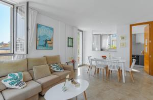 a living room with a couch and a table at Chalet Molins 5 By home villas 360 in Cala de Sant Vicent