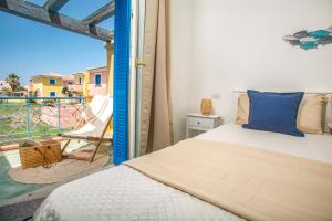 a bedroom with a bed and a balcony at BILANCIA VI 30' Porto Cervo & PRIVATE TERRACE with Sea View in Santa Teresa Gallura +42 photos