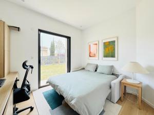 Postel nebo postele na pokoji v ubytování VILLA JAVA - Piscine Terrasse 8 minutes des Plages