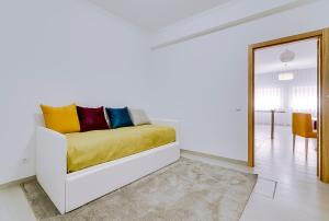 Cama ou camas em um quarto em Apartamentos Sol & Ria