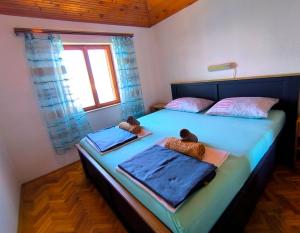 Postel nebo postele na pokoji v ubytování Apartments by the sea Mali Losinj (Losinj) - 8006