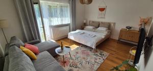 Postel nebo postele na pokoji v ubytování Zeus apartmán