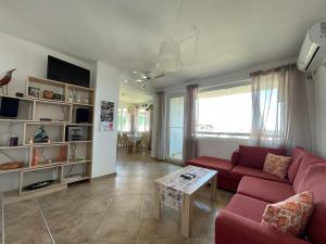 A television and/or entertainment centre at Caprice Apartment in Lozenec