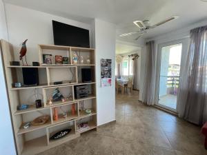 A television and/or entertainment centre at Caprice Apartment in Lozenec