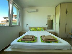 A bed or beds in a room at Caprice Apartment in Lozenec