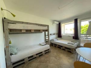 A bed or beds in a room at Caprice Apartment in Lozenec Még 37 kép