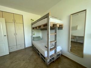 A bed or beds in a room at Caprice Apartment in Lozenec