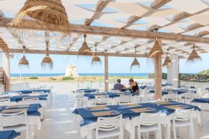 Restoran või mõni muu söögikoht majutusasutuses Baia Di Torre Squillace