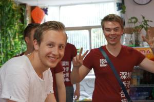 a group of young men posing for a picture at Notting Hill Hostel in Bao'an