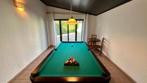 a pool table in a living room with at Gemini by Check-in Portugal in Albufeira