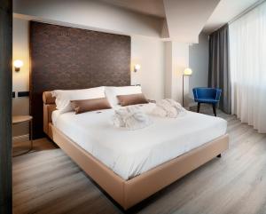 Postel nebo postele na pokoji v ubytování Tuscany Inn