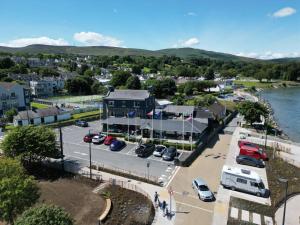 an aerial view of a town with a parking lot at Grand Central Hotel in Ó Méith
