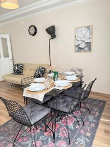 a dining room with a table and chairs at Seaview 2BR 2BA Apartment in Antalya Lara Cliffs in Antalya