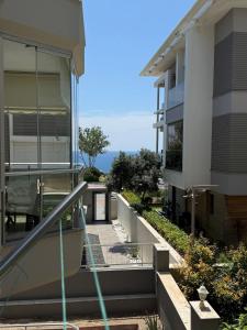 an external view of a building with a stairway at Seaview 2BR 2BA Apartment in Antalya Lara Cliffs in Antalya