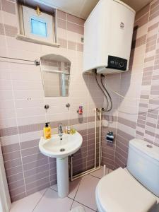 a bathroom with a sink and a toilet at Seaview 2BR 2BA Apartment in Antalya Lara Cliffs in Antalya +44 photos