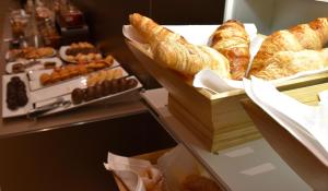 a bakery with various types of bread and pastries at Hotel Taburiente S.C.Tenerife in Santa Cruz de Tenerife