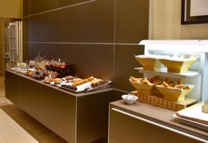 a buffet line with various types of food on display at Hotel Taburiente S.C.Tenerife in Santa Cruz de Tenerife