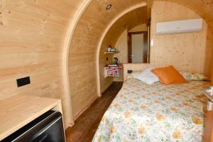 a bedroom with a bed in a wooden room at Terre Di Nacchia in Capodimonte +53 photos