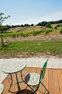 a table and two chairs sitting on a wooden deck at Terre Di Nacchia in Capodimonte