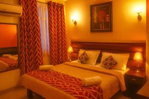 a hotel room with two beds and a window at Hotel Eurostar International By Quality Inn in New Delhi +26 photos