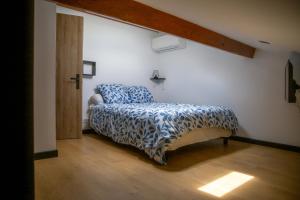 Ένα ή περισσότερα κρεβάτια σε δωμάτιο στο Appartement Caraman